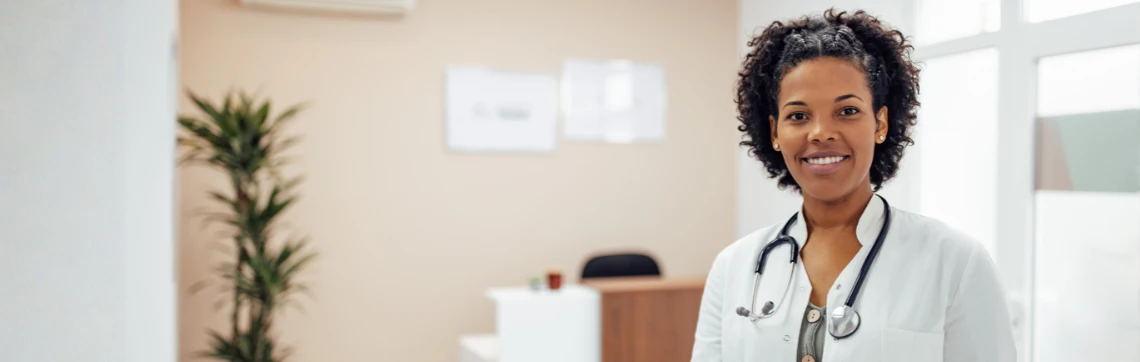 Doctor stands in the entry way of her private practice