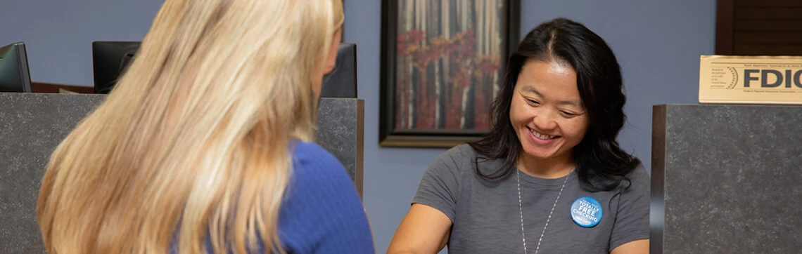 Bank teller assisting a member